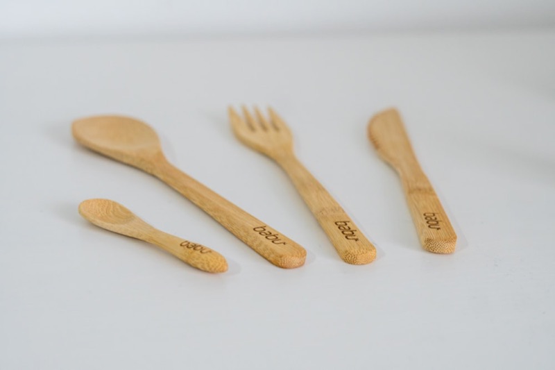 Pair of bamboo chopsticks on a neutral background