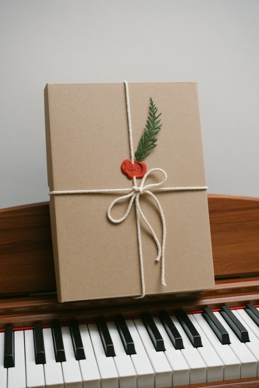 A wrapped gift set with a wax seal